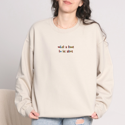 WHAT A TIME TO BE ALIVE - Embroidered Unisex Crewneck Sweatshirt