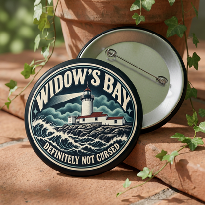 3. Image alt text
Round Widow’s Bay lighthouse pin in navy, seafoam, and cream with “Definitely Not Cursed” lettering.