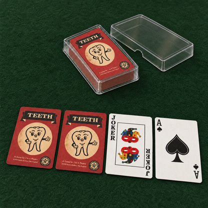 Widow’s Bay inspired TEETH playing cards on green felt, showing two vintage red card backs, a Joker, an Ace of Spades, and a deck in an open clear case.