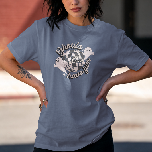 Blue Jean Comfort Colors T-shirt with two smiling ghosts, a distressed disco ball, and cream retro lettering reading “Ghouls just wanna have fun.”